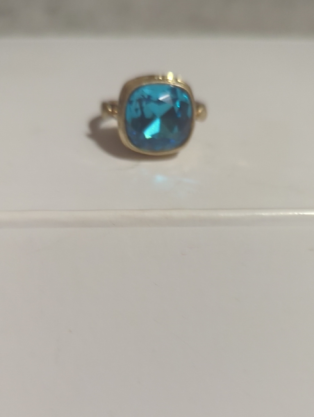 Gold Ring with Blue Cushion-Cut Stone
